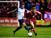 18 February 2022; Aodh Dervin of Shelbourne is tackled by Billy King of St Patrick's Athletic during the SSE Airtricity League Premier Division match between Shelbourne and St Patrick's Athletic at Tolka Park in Dublin. Photo by Sam Barnes/Sportsfile