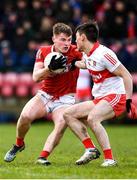 20 February 2022; Fionn Herlihy of Cork in action against Conor McCluskey of Derry  during the Allianz Football League Division 2 match between Derry and Cork at Derry GAA Centre of Excellence in Owenbeg, Derry. Photo by Sam Barnes/Sportsfile