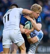 19 February 2022; Jamie Osborne of Leinster is tackled by Luke Morgan and Michael Collins of Ospreys during the United Rugby Championship match between Leinster and Ospreys at RDS Arena in Dublin. Photo by Brendan Moran/Sportsfile