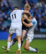 19 February 2022; Jamie Osborne of Leinster is tackled by Luke Morgan and Michael Collins of Ospreys during the United Rugby Championship match between Leinster and Ospreys at RDS Arena in Dublin. Photo by Brendan Moran/Sportsfile