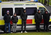 20 February 2022; Supporters take shelter beside an ambulance during the Allianz Football League Division 4 match between Leitrim and London at Connacht GAA Centre of Excellence in Bekan, Mayo. Photo by Ray McManus/Sportsfile
