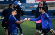 21 February 2022; Jacob Barrett fist bumps Jack Dunne during a Leinster Rugby squad training session at Energia Park in Dublin. Photo by Harry Murphy/Sportsfile