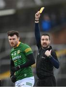 20 February 2022; Jordan Morris of Meath is shown a yellow card by referee Noel Mooney during the Allianz Football League Division 2 match between Meath and Down at Pairc Táilteann in Navan, Meath. Photo by Stephen McCarthy/Sportsfile