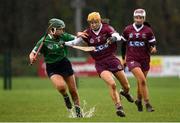 20 February 2022; Tina Bradley of Slaughtneil in action against Tara Kenny of Sarsfields during the AIB All-Ireland Senior Camogie Club Championship Semi-Final match between Sarsfields and Slaughtneil at Naomh Eanna in Gorey, Wexford. Photo by Matt Browne/Sportsfile