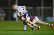 16 February 2022; Ciarán Donnelly of UL in action against Cathal Heneghan of NUI Galway during the Electric Ireland HE GAA Sigerson Cup Final match between NUI Galway and University of Limerick at IT Carlow in Carlow. Photo by Piaras Ó Mídheach/Sportsfile