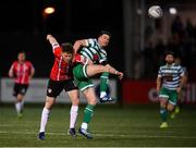 25 February 2022; Ronan Finn of Shamrock Rovers is tackled by Cameron McJannet of Derry City during the SSE Airtricity League Premier Division match between Derry City and Shamrock Rovers at The Ryan McBride Brandywell Stadium in Derry. Photo by Stephen McCarthy/Sportsfile