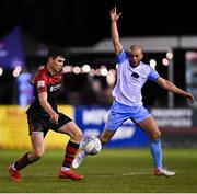 25 February 2022; James Clarke of Drogheda United in action against Mark Coyle of Shelbourne during the SSE Airtricity League Premier Division match between Drogheda United and Shelbourne at Head in the Game Park in Drogheda, Louth. Photo by Ramsey Cardy/Sportsfile