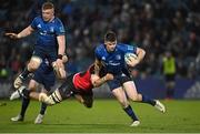 25 February 2022; Harry Byrne of Leinster is tackled by PJ Steenkamp of Emirates Lions during the United Rugby Championship match between Leinster and Emirates Lions at the RDS Arena in Dublin. Photo by Seb Daly/Sportsfile