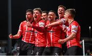 25 February 2022; Will Patching, left, celebrates with Derry City team-mates after scoring their side's first goal during the SSE Airtricity League Premier Division match between Derry City and Shamrock Rovers at The Ryan McBride Brandywell Stadium in Derry. Photo by Stephen McCarthy/Sportsfile