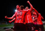 25 February 2022; Will Patching, left, celebrates with Derry City teammates after scoring their side's first goal during the SSE Airtricity League Premier Division match between Derry City and Shamrock Rovers at The Ryan McBride Brandywell Stadium in Derry. Photo by Stephen McCarthy/Sportsfile