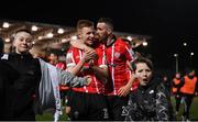 25 February 2022; Brandon Kavanagh, left, and Daniel Lafferty of Derry City celebrate after the SSE Airtricity League Premier Division match between Derry City and Shamrock Rovers at The Ryan McBride Brandywell Stadium in Derry. Photo by Stephen McCarthy/Sportsfile