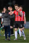 25 February 2022; Brandon Kavanagh of Derry City celebrates with a supporter after the SSE Airtricity League Premier Division match between Derry City and Shamrock Rovers at The Ryan McBride Brandywell Stadium in Derry. Photo by Stephen McCarthy/Sportsfile