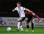 25 February 2022; John Martin of Dundalk in action against Kris Twardek of Bohemians during the SSE Airtricity League Premier Division match between Bohemians and Dundalk at Dalymount Park in Dublin. Photo by Michael P Ryan/Sportsfile