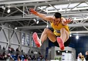 26 February 2022; Shane Howard of Bandon AC, Cork, on his way to winning the senior men's long jump during day one of the Irish Life Health National Senior Indoor Athletics Championships at the National Indoor Arena at the Sport Ireland Campus in Dublin. Photo by Sam Barnes/Sportsfile