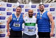 26 February 2022; Senior men's shot put medallists, Eric Favors of Raheny Shamrock AC, Dublin, gold, James Kelly of Finn Valley AC, Donegal, silver and Gavin Mclaughlin of Finn Valley AC, Donegal, bronze, during day one of the Irish Life Health National Senior Indoor Athletics Championships at the National Indoor Arena at the Sport Ireland Campus in Dublin. Photo by Sam Barnes/Sportsfile