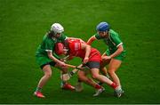26 February 2022; Sorcha McCartan of Cork is tackled by Marian Quaid, right, and Aoife Coughlan of Limerick during the Littlewoods Ireland Camogie League Division 1 Round 2 match between Cork and Limerick at Páirc Ui Chaoimh in Cork. Photo by Eóin Noonan/Sportsfile