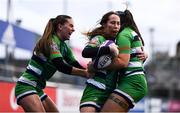 26 February 2022; Emily McKeown of Suttonians, centre, celebrates with teammates after scoring their side's first try during the Energia Women's All-Ireland League Conference Final match between Suttonians and Galwegians at Energia Park in Dublin. Photo by Ben McShane/Sportsfile