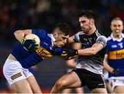 26 February 2022; Mark Russell of Tipperary in action against Mikey Gordon of Sligo during the Allianz Football League Division 4 match between Tipperary and Sligo at FBD Semple Stadium in Thurles, Tipperary. Photo by David Fitzgerald/Sportsfile
