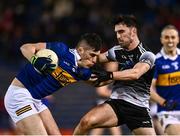 26 February 2022; Mark Russell of Tipperary in action against Mikey Gordon of Sligo during the Allianz Football League Division 4 match between Tipperary and Sligo at FBD Semple Stadium in Thurles, Tipperary. Photo by David Fitzgerald/Sportsfile