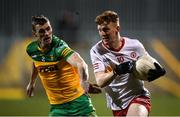 26 February 2022; Nathan Donnelly of Tyrone in action against Caolan Ward of Donegal during the Allianz Football League Division 1 match between Donegal and Tyrone at MacCumhaill Park in Ballybofey, Donegal. Photo by Stephen McCarthy/Sportsfile
