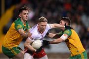 26 February 2022; Frank Burns of Tyrone in action against Jason McGee, left, and Peader Mogan of Donegal during the Allianz Football League Division 1 match between Donegal and Tyrone at MacCumhaill Park in Ballybofey, Donegal. Photo by Stephen McCarthy/Sportsfile