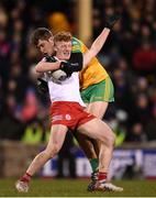 26 February 2022; Nathan Donnelly of Tyrone is tackled by Hugh McFadden of Donegal during the Allianz Football League Division 1 match between Donegal and Tyrone at MacCumhaill Park in Ballybofey, Donegal. Photo by Stephen McCarthy/Sportsfile
