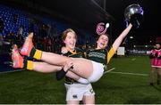 26 February 2022; Emma Murphy of Railway Union lifts captain Niamh Byrne and the cup after the Energia Women's All-Ireland League Final match between Blackrock College and Railway Union at Energia Park in Dublin. Photo by Ben McShane/Sportsfile