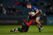 25 February 2022; Scott Penny of Leinster is tackled by Sti Sithole of Emirates Lions during the United Rugby Championship match between Leinster and Emirates Lions at the RDS Arena in Dublin. Photo by Seb Daly/Sportsfile