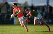 27 February 2022; Jarly Og Burns of Armagh is tackled by Fionn McDonagh of Mayo during the Allianz Football League Division 1 match between Mayo and Armagh at Dr Hyde Park in Roscommon. Photo by Ramsey Cardy/Sportsfile