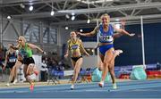 27 February 2022; Molly Scott of St Laurence O'Toole AC, Carlow, right, dips for the line to win the senior women's 60m final in a national record time of 7.19, after the final had to be re-run during day two of the Irish Life Health National Senior Indoor Athletics Championships at the National Indoor Arena at the Sport Ireland Campus in Dublin. Photo by Sam Barnes/Sportsfile