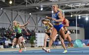 27 February 2022; Molly Scott of St Laurence O'Toole AC, Carlow, right, dips for the line to win the senior women's 60m final in a national record time of 7.19, after the final had to be re-run during day two of the Irish Life Health National Senior Indoor Athletics Championships at the National Indoor Arena at the Sport Ireland Campus in Dublin. Photo by Sam Barnes/Sportsfile