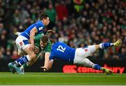 27 February 2022; Garry Ringrose of Ireland is tackled by Paolo Garbisi, left, and Leonardo Marin during the Guinness Six Nations Rugby Championship match between Ireland and Italy at the Aviva Stadium in Dublin. Photo by Harry Murphy/Sportsfile