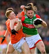 27 February 2022; Padraig O'Hora of Mayo is tackled by Ciaran Mackin of Armagh during the Allianz Football League Division 1 match between Mayo and Armagh at Dr Hyde Park in Roscommon. Photo by Ramsey Cardy/Sportsfile