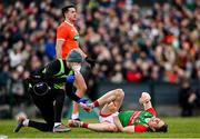 27 February 2022; Lee Keegan of Mayo receives treatment for an injury during the Allianz Football League Division 1 match between Mayo and Armagh at Dr Hyde Park in Roscommon. Photo by Ramsey Cardy/Sportsfile
