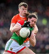 27 February 2022; Padraig O'Hora of Mayo in action against Aidan Nugent of Armagh during the Allianz Football League Division 1 match between Mayo and Armagh at Dr Hyde Park in Roscommon. Photo by Ramsey Cardy/Sportsfile