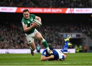 27 February 2022; Michael Lowry of Ireland evades the tackle of Ignacio Brex of Italy on his way to scoring his side's third try during the Guinness Six Nations Rugby Championship match between Ireland and Italy at the Aviva Stadium in Dublin. Photo by Harry Murphy/Sportsfile