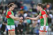 27 February 2022; Oisin Mullin, left, and Lee Keegan of Mayo after the Allianz Football League Division 1 match between Mayo and Armagh at Dr Hyde Park in Roscommon. Photo by Ramsey Cardy/Sportsfile