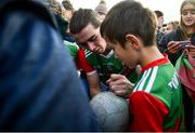 27 February 2022; Oisin Mullin of Mayo with supporters after the Allianz Football League Division 1 match between Mayo and Armagh at Dr Hyde Park in Roscommon. Photo by Ramsey Cardy/Sportsfile