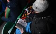 27 February 2022; A supporter reads The Body: A Guide for Occupants by Bill Bryson before the Allianz Football League Division 1 match between Monaghan and Kerry at Inniskeen Grattans GAA Club in Monaghan. Photo by Stephen McCarthy/Sportsfile