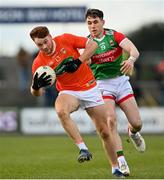 27 February 2022; Jason Duffy of Armagh in action against Paddy Durcan of Mayo during the Allianz Football League Division 1 match between Mayo and Armagh at Dr Hyde Park in Roscommon. Photo by Ramsey Cardy/Sportsfile