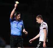 25 February 2022; Daniel Kelly of Dundalk is shown a yellow card from referee Paul McLaughlin during the SSE Airtricity League Premier Division match between Bohemians and Dundalk at Dalymount Park in Dublin. Photo by Michael P Ryan/Sportsfile