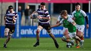 28 February 2022; Ben Blaney of Terenure College breaks clear of the tackle of Charlie Kennedy of Gonzaga College during the Bank of Ireland Leinster Rugby Schools Junior Cup 1st Round match between Terenure College, Dublin, and Gonzaga College, Dublin, at Energia Park in Dublin. Photo by Brendan Moran/Sportsfile