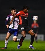 28 February 2022; Promise Omochere of Bohemians in action against Jack Scott of St Patrick's Athletic during the SSE Airtricity League Premier Division match between Bohemians and St Patrick's Athletic at Dalymount Park in Dublin. Photo by Eóin Noonan/Sportsfile