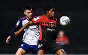 28 February 2022; Promise Omochere of Bohemians in action against Jack Scott of St Patrick's Athletic during the SSE Airtricity League Premier Division match between Bohemians and St Patrick's Athletic at Dalymount Park in Dublin. Photo by Eóin Noonan/Sportsfile