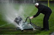 28 February 2022; Tony Sheridan of the UCD groundstaff attempts to stop a sprinkler with a wheelbarrow during the SSE Airtricity League Premier Division match between UCD and Shelbourne at UCD Bowl in Belfield, Dublin. Photo by Harry Murphy/Sportsfile