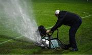 28 February 2022; Tony Sheridan of the UCD groundstaff attempts to stop a sprinkler with a wheelbarrow during the SSE Airtricity League Premier Division match between UCD and Shelbourne at UCD Bowl in Belfield, Dublin. Photo by Harry Murphy/Sportsfile
