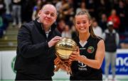 1 March 2022; Gaelcholáiste Tralee captain Paris Nic Cárthaigh is presented with the MVP by Baskeball Ireland president PJ Reidy after the Basketball Ireland U19B Girls Schools League Final match between St. Louis Kiltimagh, Mayo and Gaelcholáiste Tralee, Kerry at National Basketball Arena in Dublin. Photo by Brendan Moran/Sportsfile