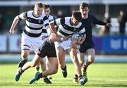 1 March 2022; Alex Clarke of Belvedere College is tackled by Jack Freyne of Wesley College during the Bank of Ireland Leinster Rugby Schools Junior Cup 1st Round match between Belvedere College, Dublin, and Wesley College, Dublin, at Energia Park in Dublin. Photo by David Fitzgerald/Sportsfile