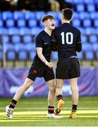 1 March 2022; Christopher MacLachlann Hickey of Wesley College, right, is congratulated by team mate Jack Freyne after he kicked the match winning penalty during the Bank of Ireland Leinster Rugby Schools Junior Cup 1st Round match between Belvedere College, Dublin, and Wesley College, Dublin, at Energia Park in Dublin. Photo by David Fitzgerald/Sportsfile