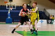2 March 2022; Michael Galvin of St Michael's Listowel in action against Darragh Gelston of Kishoge during the Basketball Ireland U16C Boys Schools League Final match between Kishoge Community College, Dublin, and St Michael's College Listowel, Kerry, at the National Basketball Arena in Dublin. Photo by Seb Daly/Sportsfile